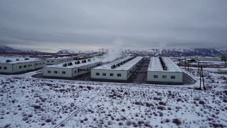 geothermal power plant in a snowy mountainous region