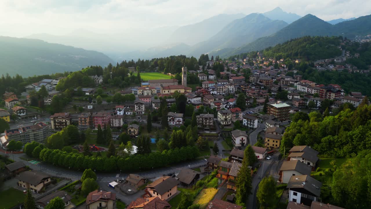 A warm morning light touches Selvino’s terracotta homes and green forest ridges. Shot at Selvino, Italy (Italia)