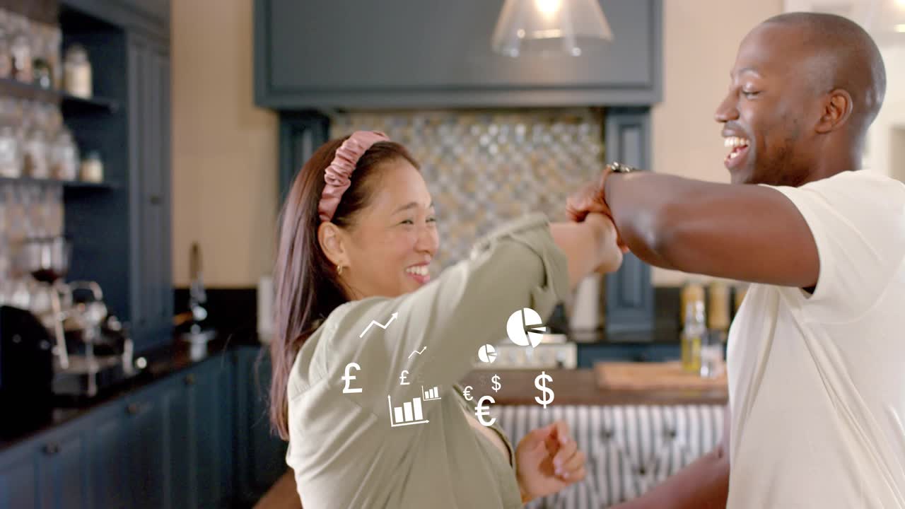 Finance charts appearing, man and woman clasping hands and swaying in kitchen, showing growth