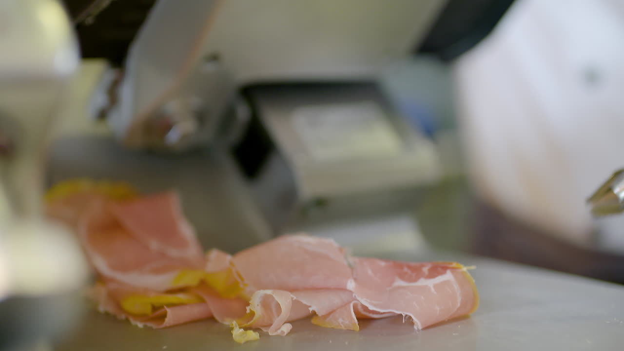 Cutting Fresh Parma Cheese On Meat Cutting Machine