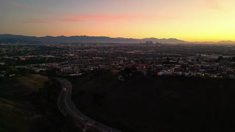 aerial drone shot over downtown in los angeles, california after sunset