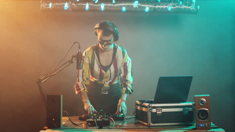 disc jockey shows timeout sign on club stage