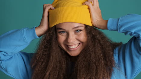 caucasian curly haired woman wearing winter clothes.