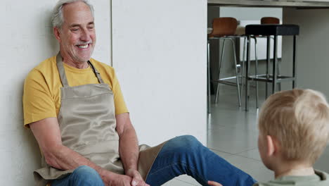 man and boy in kitchen