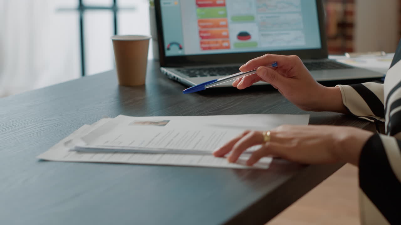 Office worker searching expertise information on resume