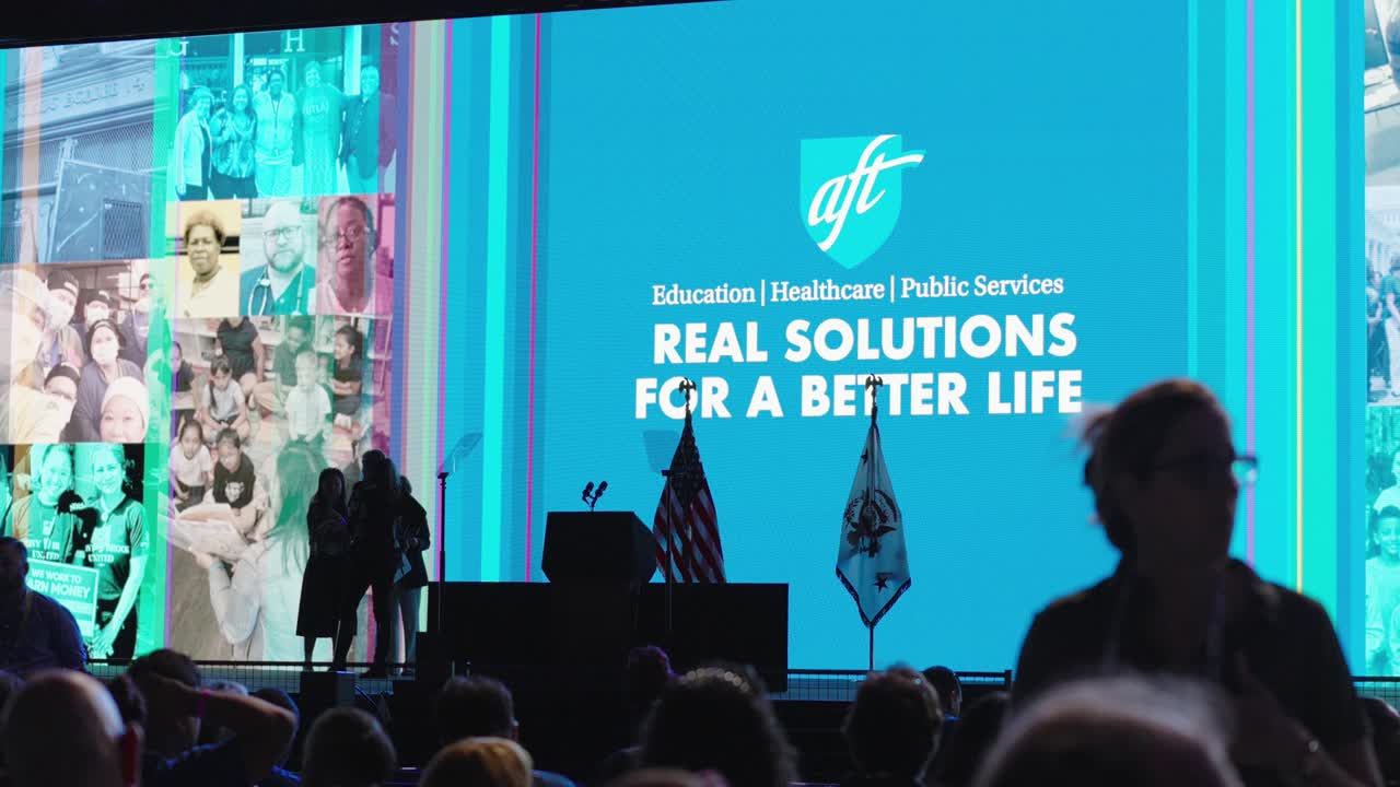 Establishing shot of people participating in Teachers Union at conference hall