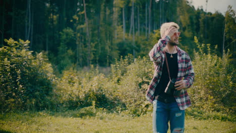 young man exploring forest during vacation