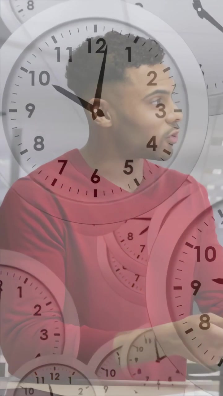 Video vertical: Hombre leyendo y moviéndose en un escritorio de oficina, con relojes que aparecen para indicar la urgencia de una fecha límite.