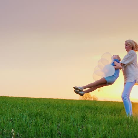 mother playing with her daughter laughing