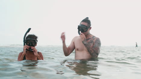 couple diving with masks on