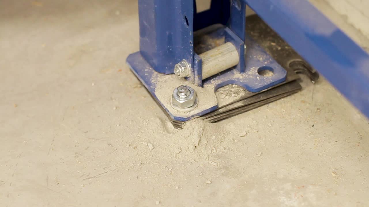 Worker hammer into concrete