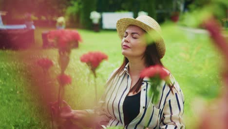 woman enjoying nature in a vibrant garden surrounded by colorful flowers and greenery