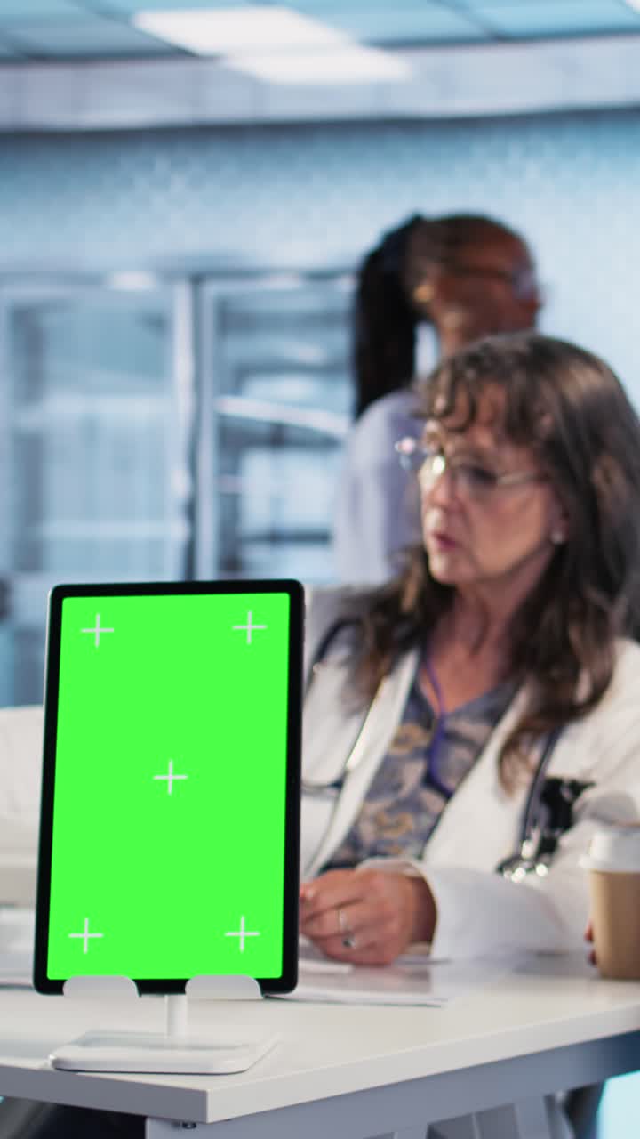 Doctor Consultation with Green Screen Tablet