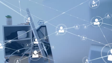 animation of network of connections with icons over caucasian businessman using computer
