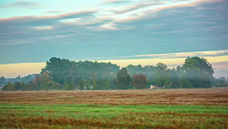 Misty-Atmosphere-Over-Agricultural-Fields-Near-Countryside.-Timelapse