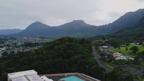 highway cutting through the mountains of hawaii
