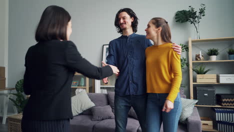 real estate agent meeting with couple in a new home