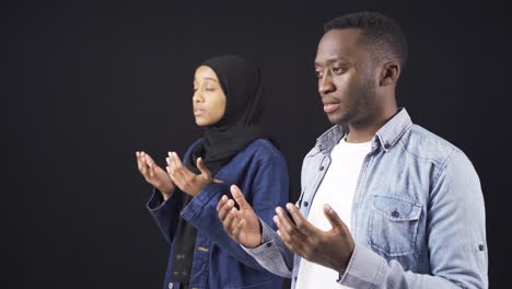 african muslim youth praying. muslim youth praying and worshiping allah.