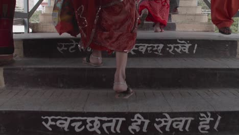 slow motion footage, females in traditional dress, symbolic message