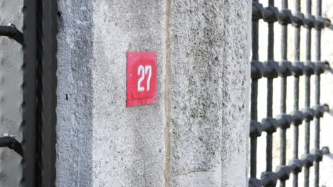 house number 27 with metal gate