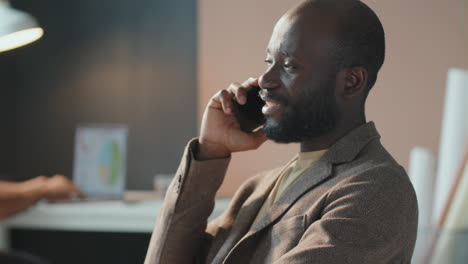 black man talking on phone