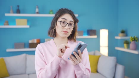 Confused-young-woman-reading-good-news.