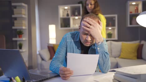 Debtor-and-bankrupt-desperate-man-cries-and-his-wife-hugs-him.