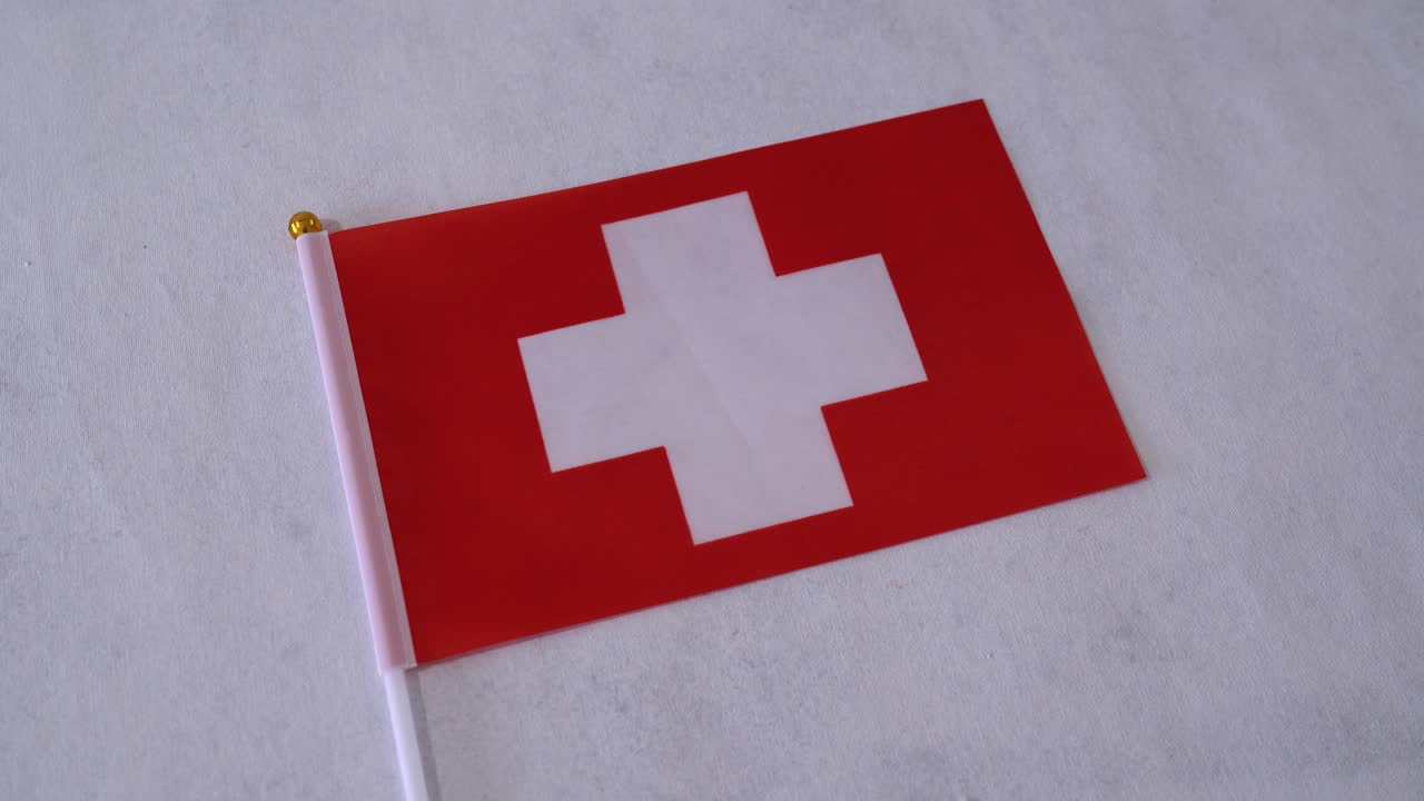 Switzerland flag close up on white background. Swiss national flag