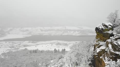 Aerial-view-of-a-snow-covered-Emigrant-Lake-near-Ashland,-Oregon