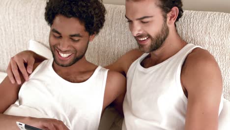 gay couple relaxing in the bed