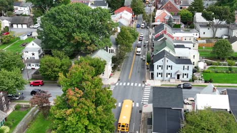 yellow school bus driving on road