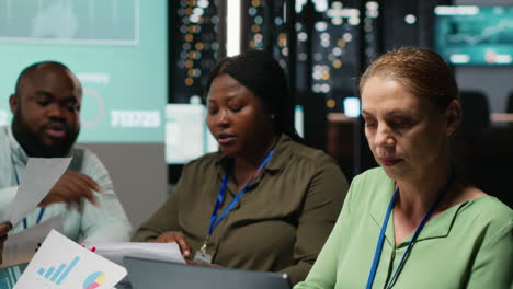 female supervisor and her staff members reviewing efficiency metrics