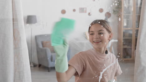 caucasian girl cleaning window