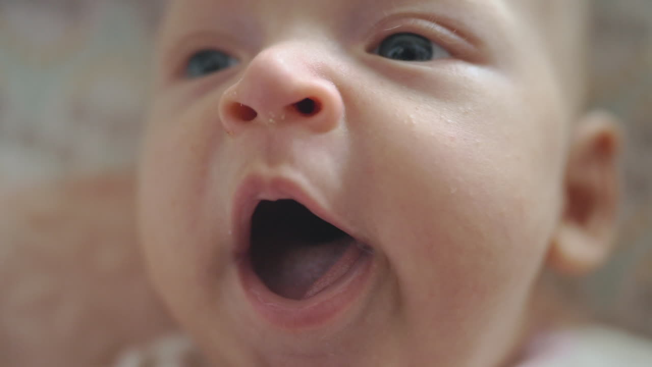 Sleepy baby girl yawning