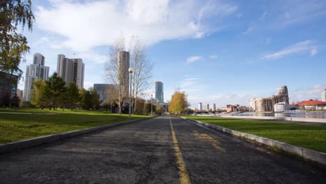 autumn city park with modern architecture