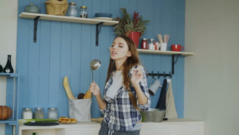 woman singing in kitchen