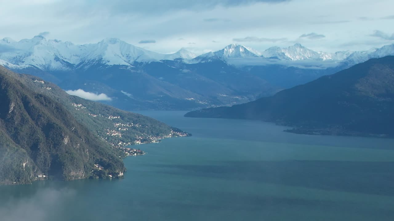 Breathtaking aerial view of the Italian Alps with serene lake landscape