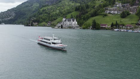 breathtaking aerial view of ferry boat crossing lake lucerne near vitznau