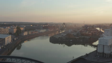 Cargo-Port-Area-on-River-in-Early-morning-haze,-no-traffic-in-Frankfurt-am-Main,-Germany