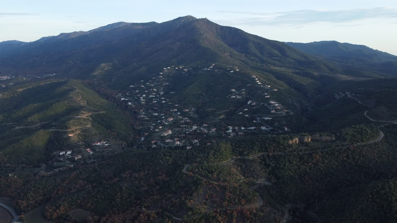 Aerial view of a mountain village nestled in a valley