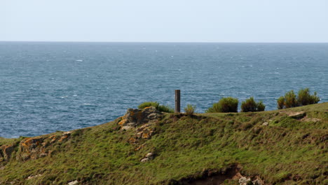 long shot of hms warspite monument at bessy's cove, the enys