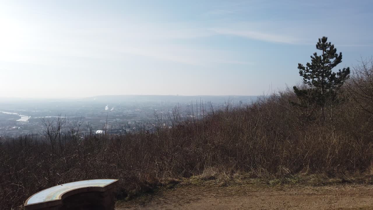 A scenic view from Plateau de Malzéville, overlooking the expansive landscape below. The image captures the serene beauty of the region with a clear sky and distant horizon.