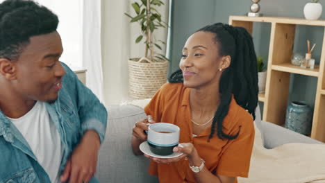 Coffee,-relax-and-black-couple-on-sofa-in-home