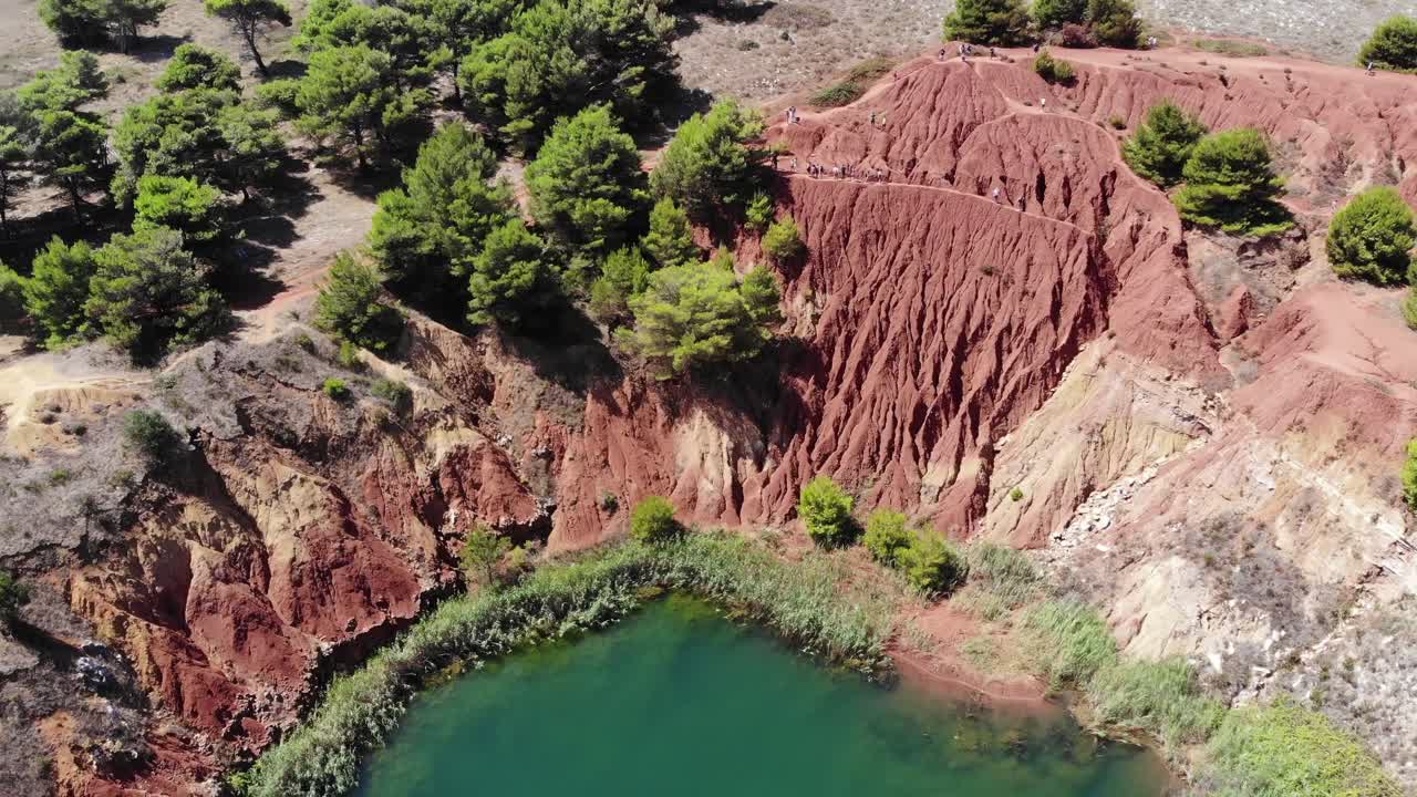 Drone flies down during a rotation over Bauxite cave in Puglia