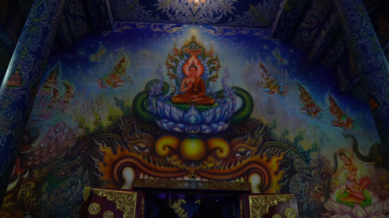 Amazing paint work inside the main prayer house at Wat Rong Sear Tean (Blue Temple). Chiang Rai, Thailand.