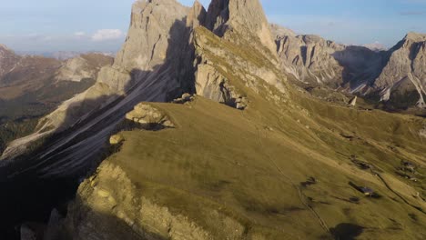 pan up reveals seceda mountain in odle group, italian dolomites mountain range