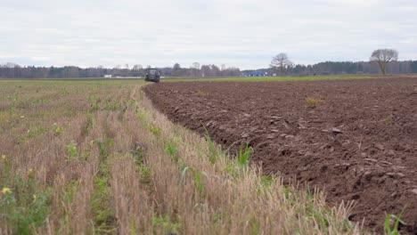 static low pov shot of farm tractor approaching