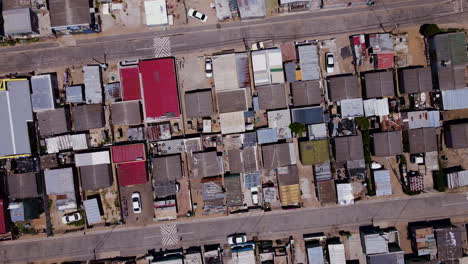 rising aerial twisting shot over ghetto township in south africa