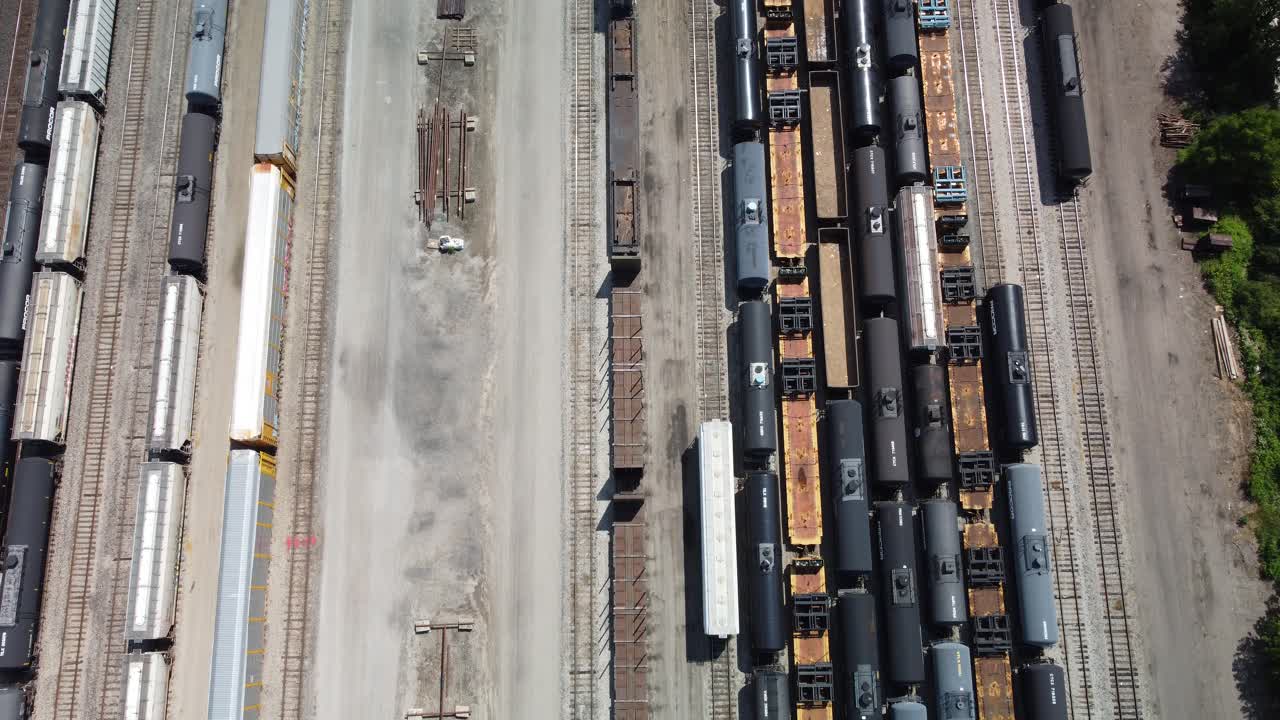 A single rail cart moving in a large yard preparing to depart