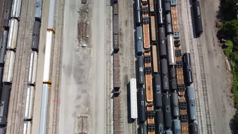 a single rail cart moving in a large yard preparing to depart